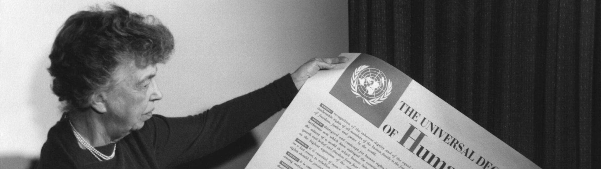 Eleanor Roosevelt holding the universal declaration of human rights